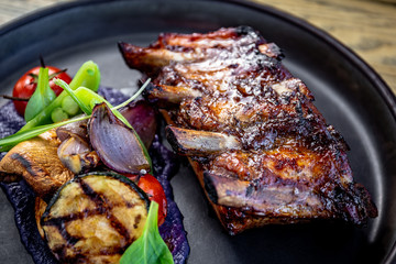 Grilled ribs with bbq sauce, purple potato purée