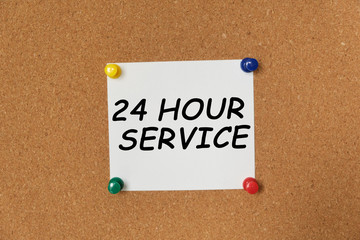 Text 24 HOUR SERVICE written on a sticker