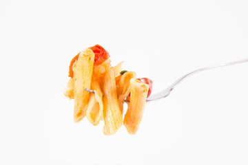 Penne with tomatoes, garlic and mozzarella on a fork on a white background