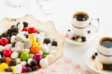 Obraz na płótnie Canvas Traditional Turkish Delights and candies on white with coffee.Holidays concept.