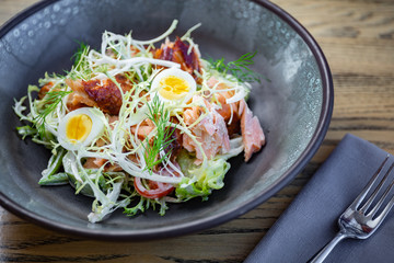 Smoked pork salad with fresh green leaves, eggs
