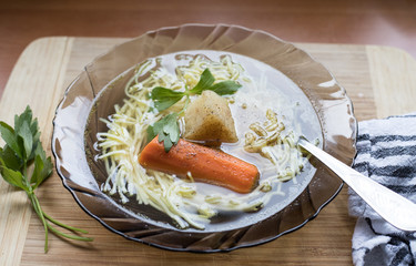 Polish chicken soup with noodles and parsley