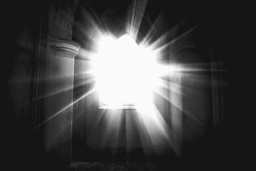 Light through the broken windows of the ruined church as a symbol of faith, Christianity and...