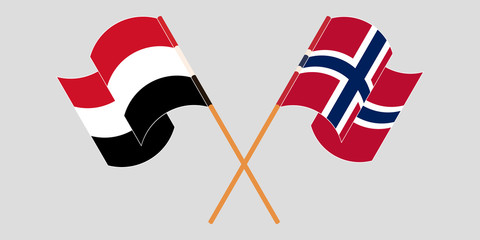 Crossed and waving flags of Yemen and Norway