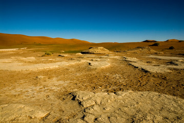 dry landscape with cracked earth dead vlei namibia