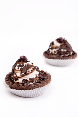 Chocolate cookie with cream and cherry on white - 347971978