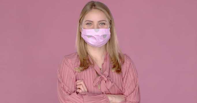 Portrait of beautiful woman wearing stylish face mask. Protection against viruses pollution