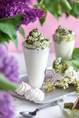 Green tea matcha milk drink on rural background - 347973393