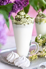 Green tea matcha milk drink on rural background - 347973587