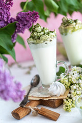 Green tea matcha milk drink on rural background - 347973923