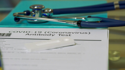 A form and finger-stick antibody test kit used to quickly determine if antibodies are present in...
