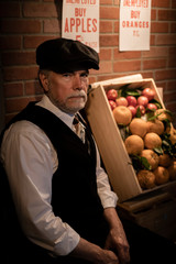 Iconic well dressed unemployed man during the Great Depression referred to as an apple hawker...