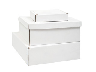 Pile of three blank white cardboard box of different sizes isolated on white background. Side view