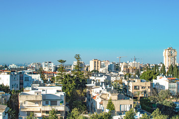 Fototapeta premium City with private houses and high-rise buildings on a background of sky