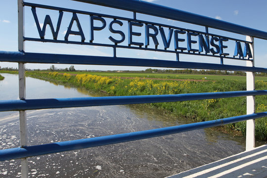Bridge, canal and Polders at Wapserveen Drenthe Netherlands. Meadows.