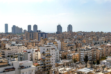 City with high-rise buildings and hotels on a background of sky