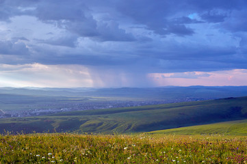 Steppes and distant green hills in the rain. Zabaykalsky Krai. Russia.