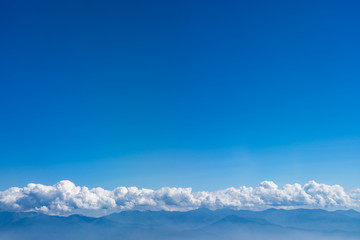 Clouds and Mountain range with blue sky background