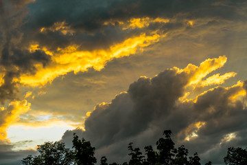 dramatic clouds illuminated by sunset at evening