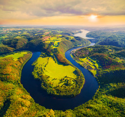 Horseshoe shape of Vltava River. Aerial view to amazing scenery close The Orlik Reservoir. Most...