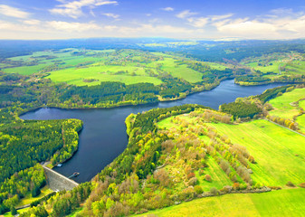 Fototapeta na wymiar The Lucina Reservoir on Mze River is hydroelectric dam in Western Bohemia. Aerial view to important source of sustainable energy and drinking water in Czech Republic.