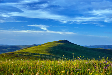 Green steppes and hills on a summer day. Zabaykalsky Krai. Russia.