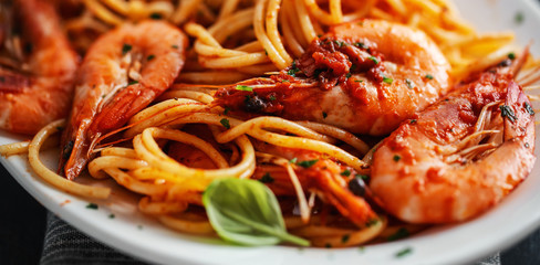 Pasta spaghetti with tomato sauce and shrimps