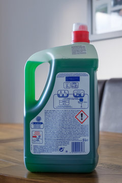 Largs, Scotland, UK - February 04, 2019: Rear Label of an extra large 5 ltr bottle of Fairy Branded washing up liquid displaying rear label with diamond shaped warning symbols and recycling symbols.