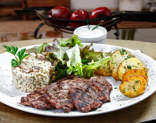 Grilled meat with trimmings