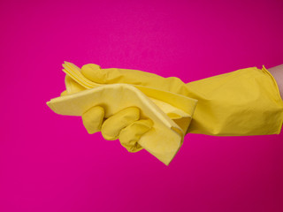 Employee hand in rubber protective glove with micro fiber cloth. Maid or housewife cares about house. general or regular clean up. Commercial cleaning company concept. disinfection products. Sanitizer