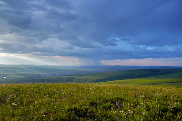 Fototapeta premium Steppes and distant green hills in the rain. Zabaykalsky Krai. Russia.