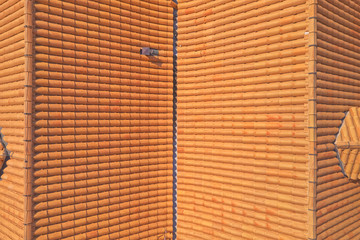 Aerial drone shot of the roof restoration on the Lazareti building in the old town of Dubrovnik. Traditional Croatian and Mediterranean roof style design.