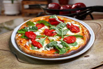 Pizza mozzarella with dried tomato