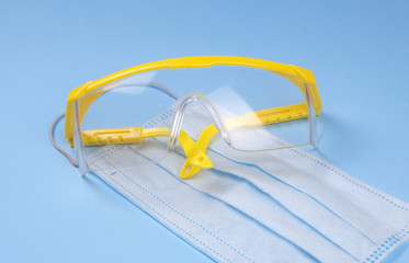 safety glasses, equipment. Medical protective masks. Covid-19 stay at home. medical background