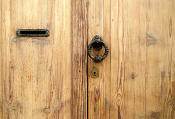 Classic decorative wooden door in warm brown color.