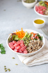 Healthy raw tuna bowl with quinoa and vegetales. Buddha bowl