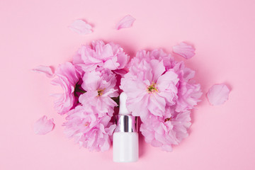 Spa dropper bottles with essence on wooden table, closeup