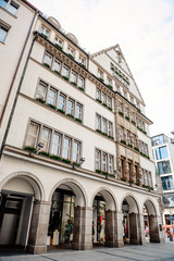 Munich, Germany - May 27, 2019: Hirmer department store in a traditional Bavarian building in downtown Munich