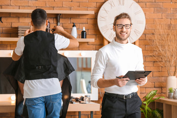 Professional hairdresser during courses in salon