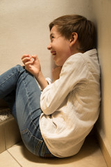 happy and laughing boy sitting on the stairs
To laugh out loud