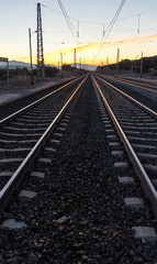 Obraz na płótnie Canvas sunset on the train tracks in Avila, Spain
