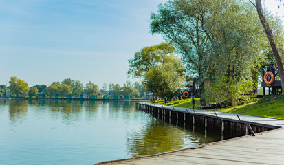 Obraz premium The deserted shore of the pond of the country hotel spring-summer 2020. Concept of the coronovirus epidemic. The collapse of the tourist business.