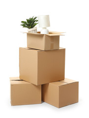 Moving boxes with belongings on white background