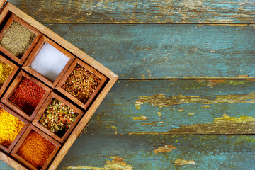 Various spices seasoning spicy in wooden box top view