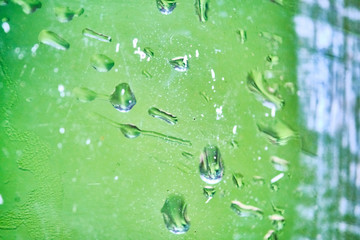 macro photo of water droplets on glass color