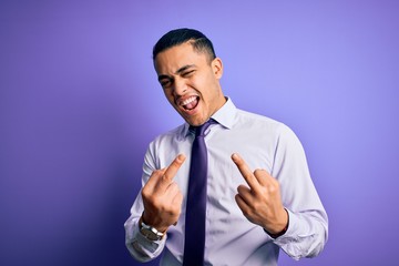 Young brazilian businessman wearing elegant tie standing over isolated purple background Showing...