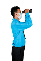 Fototapeta premium Side portrait of man peeking with his binoculars