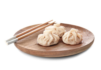 Plate with tasty dumplings on white background