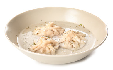Plate with tasty dumplings on white background