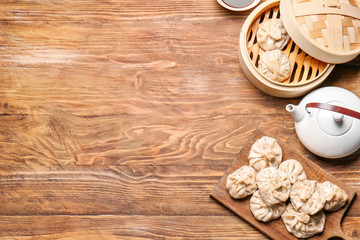 Tasty dumplings on wooden background